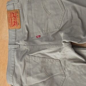 Mens Levi's tan jeans gently used 511 w 30 l 32